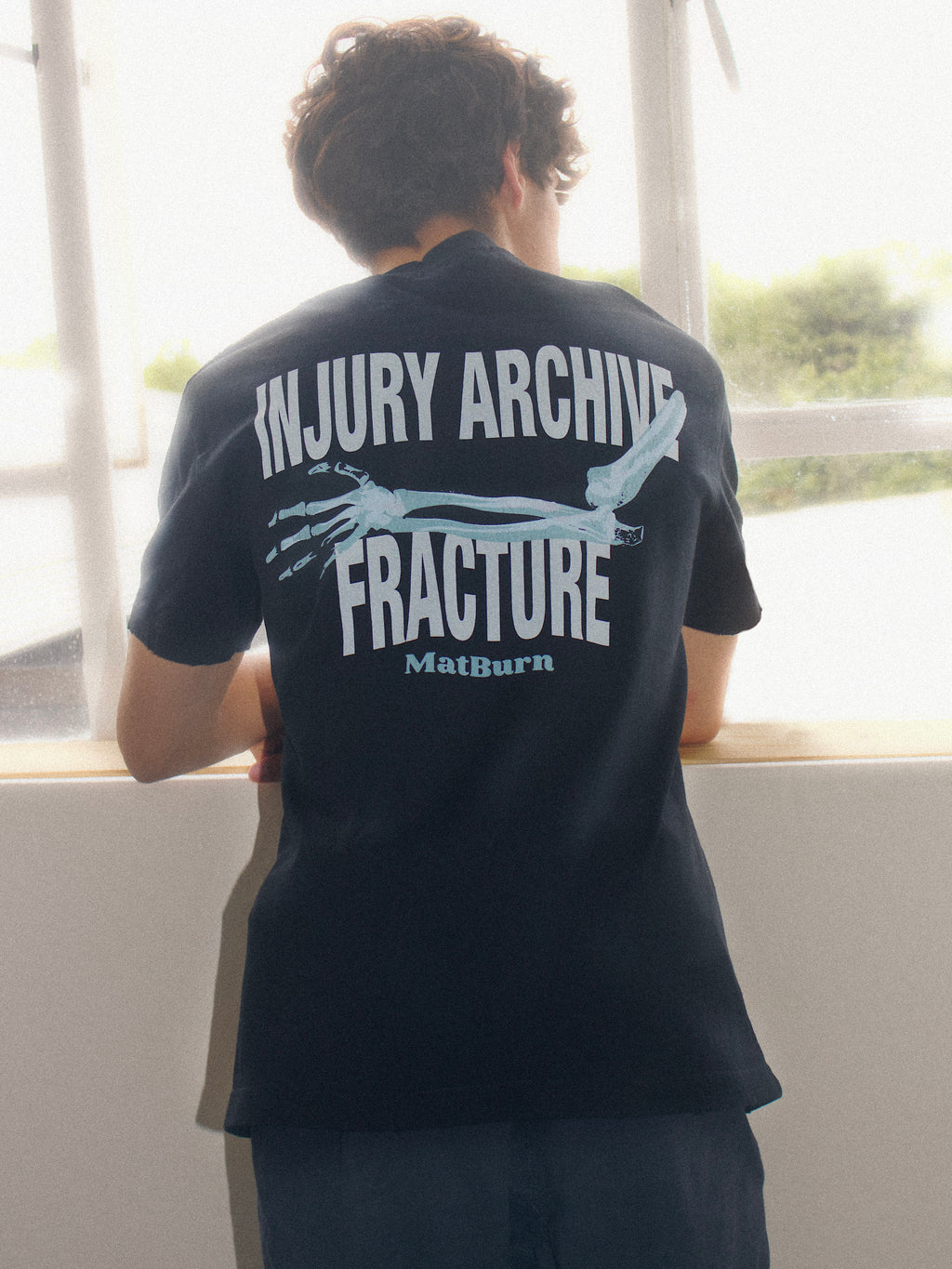 Injury Archive Tee — Washed Black