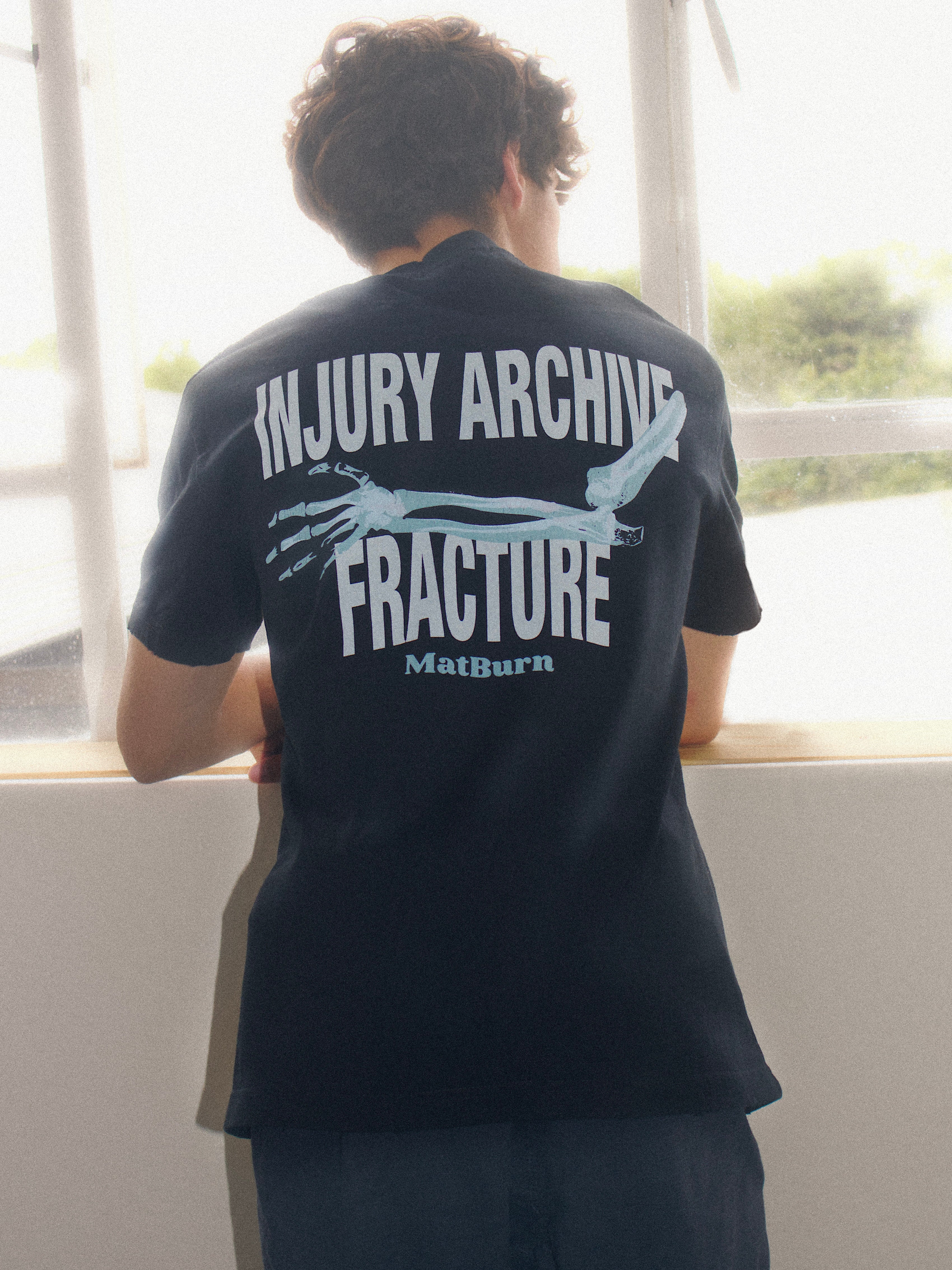 Injury Archive Tee — Washed Black